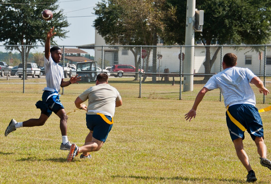 Senior Airman Christof Bader, of the 919th Aircraft Maintenance Squadron, goes up for a catch during a football game at Duke Field’s Family Day event Oct. 13.  The 919th Special Operations Wing sets aside a special day each year to show appreciation for its reservists and their family members.  Events include food, music, sports, children’s games, etc.  (U.S. Air Force photo/Tech. Sgt. Samuel King Jr.)