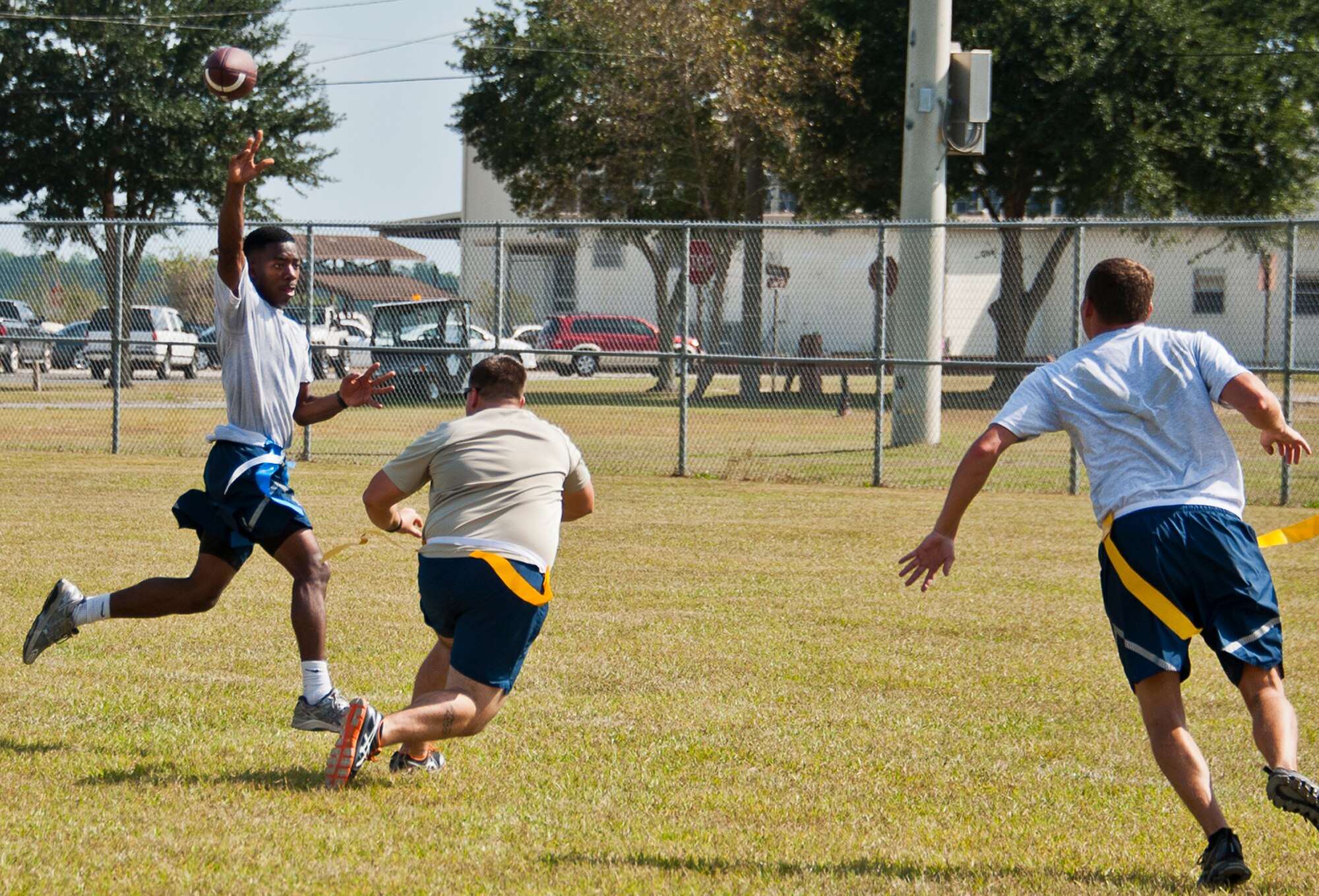 Senior Airman Christof Bader, of the 919th Aircraft Maintenance Squadron, goes up for a catch during a football game at Duke Field’s Family Day event Oct. 13.  The 919th Special Operations Wing sets aside a special day each year to show appreciation for its reservists and their family members.  Events include food, music, sports, children’s games, etc.  (U.S. Air Force photo/Tech. Sgt. Samuel King Jr.)