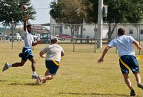Senior Airman Christof Bader, of the 919th Aircraft Maintenance Squadron, goes up for a catch during a football game at Duke Field’s Family Day event Oct. 13.  The 919th Special Operations Wing sets aside a special day each year to show appreciation for its reservists and their family members.  Events include food, music, sports, children’s games, etc.  (U.S. Air Force photo/Tech. Sgt. Samuel King Jr.)