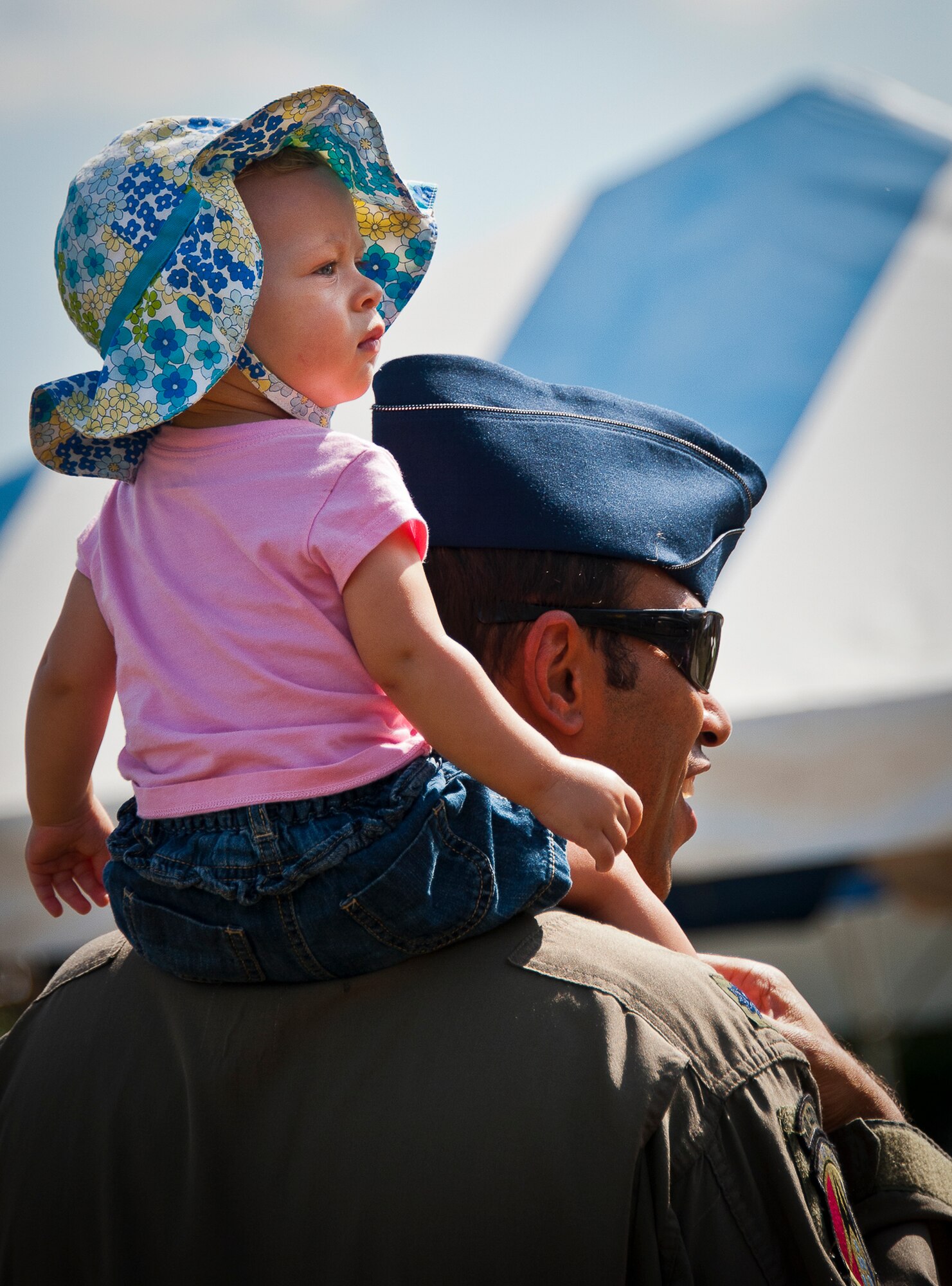 A lieutenant colonel and his daughter check out the vendor booths at Duke Field’s Family Day event Oct. 13.  The 919th Special Operations Wing sets aside a special day each year to show appreciation for its reservists and their family members.  Events include food, music, sports, children’s games, etc.  (U.S. Air Force photo/Tech. Sgt. Samuel King Jr.)