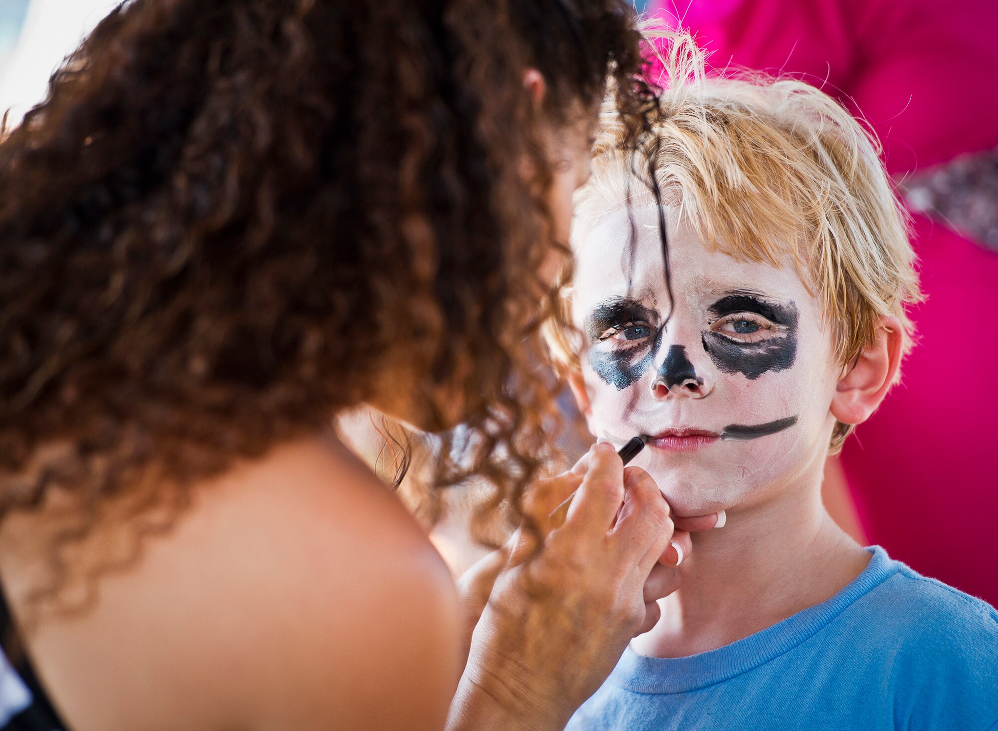 Khalin, the five-year-old son of Tech. Sgt. Sharelle Bateman, of the 919th Logistics Readiness Squadron, becomes a skeleton with the help of April Crooks at Duke Field’s Family Day event Oct. 13.  The 919th Special Operations Wing sets aside a special day each year to show appreciation for its reservists and their family members.  Events include food, music, sports, children’s games, etc.  (U.S. Air Force photo/Tech. Sgt. Samuel King Jr.)