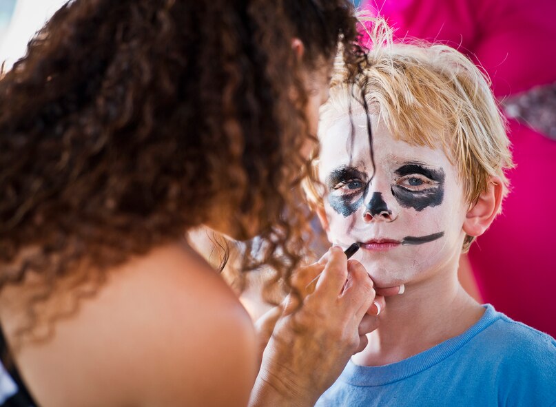 Khalin, the five-year-old son of Tech. Sgt. Sharelle Bateman, of the 919th Logistics Readiness Squadron, becomes a skeleton with the help of April Crooks at Duke Field’s Family Day event Oct. 13.  The 919th Special Operations Wing sets aside a special day each year to show appreciation for its reservists and their family members.  Events include food, music, sports, children’s games, etc.  (U.S. Air Force photo/Tech. Sgt. Samuel King Jr.)