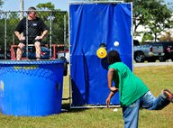 Col. Kenneth Honaker, the 919th Maintenance Group commander, prepares for the splash as he watches from the dunking booth at Duke Field’s Family Day event Oct. 13.  The 919th Special Operations Wing sets aside a special day each year to show appreciation for its reservists and their family members.  Events include food, music, sports, children’s games, etc.  (U.S. Air Force photo/Tech. Sgt. Cheryl Foster)