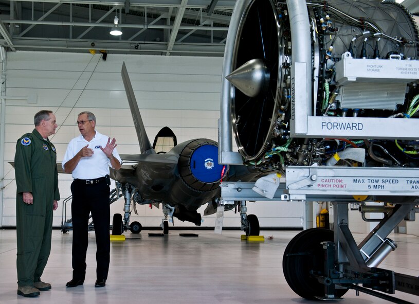 Stanley Stevens of Pratt and Whitney talks to Air Force Chief of Staff Gen. Mark A. Welsh III about the F-135 engine used in the F-35 Lightning II during the general’s visit to the 33rd Fighter Wing at Eglin Air Force Base, Fla., Oct. 16. (U.S. Air Force photo/Samuel King Jr.)