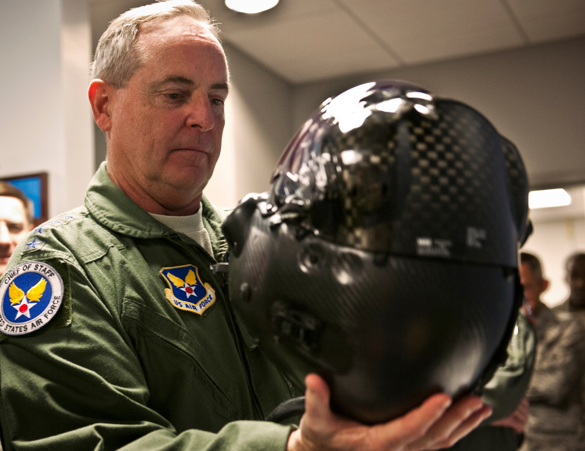 Air Force Chief of Staff Gen. Mark A. Welsh III examines the helmet used for the F-35A Lightning II joint strike fighter during his visit to the 33rd Fighter Wing at Eglin Air Force Base, Fla., Oct. 16. The 33rd Fighter Wing's unique environment is comprised of military, civilians and contractors at Eglin, who will train pilots and maintainers for all three variants of the F-35 for the Air Force, Navy and Marines. (U.S. Air Force photo/Samuel King Jr.)