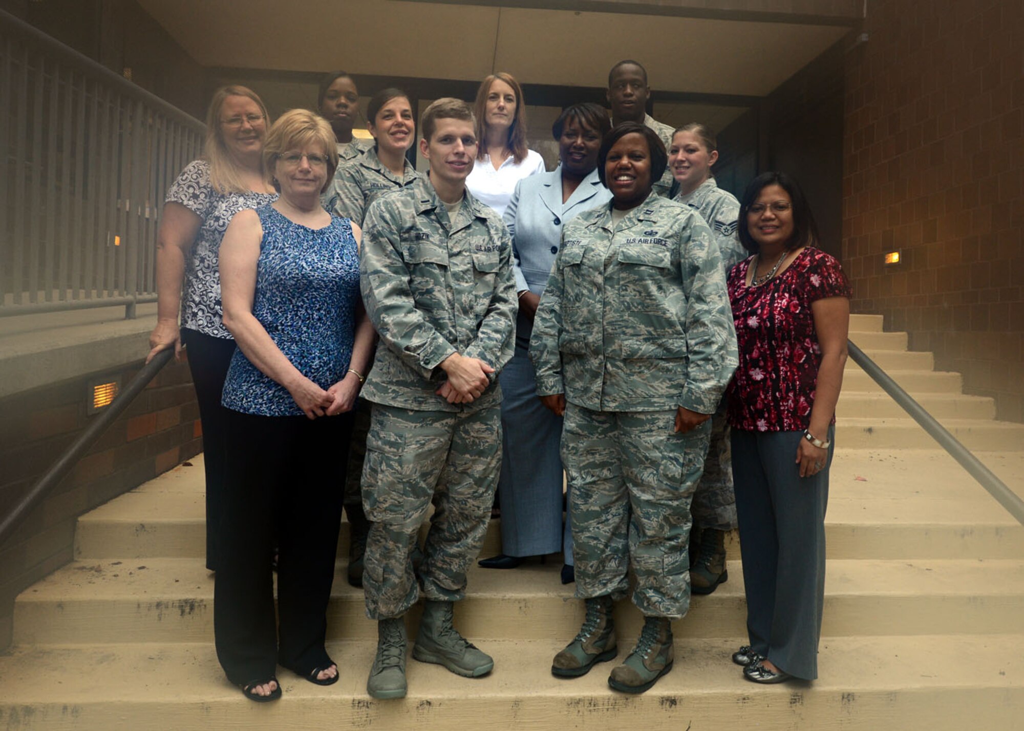 (Front row left to right) Barbara Kane, 1st Lt Richard Hozik, Capt Capri Baptiste, Mary Grace Thomas, (back row left to right), Debra Whitehorn, SrA Whitney Taylor, SSgt Jodi Hollins, Kimberly Sutton, Sharla Pope, 20th Comptroller Budget Analysts, pose for a photo Oct. 2, 2012, Shaw Air Force Base, S.C.  Not pictured: Shelia Rosser, Gloria Wilson, Steven Hornaday, SSgt Willie Hogan and SSgt Quintin Small.  The Budget Office worked until 2 a.m. on 1 Oct to close the books on another successful fiscal year.  (U.S.  Air Force photo by  Master Sgt. Cohen A. Young/Released)
