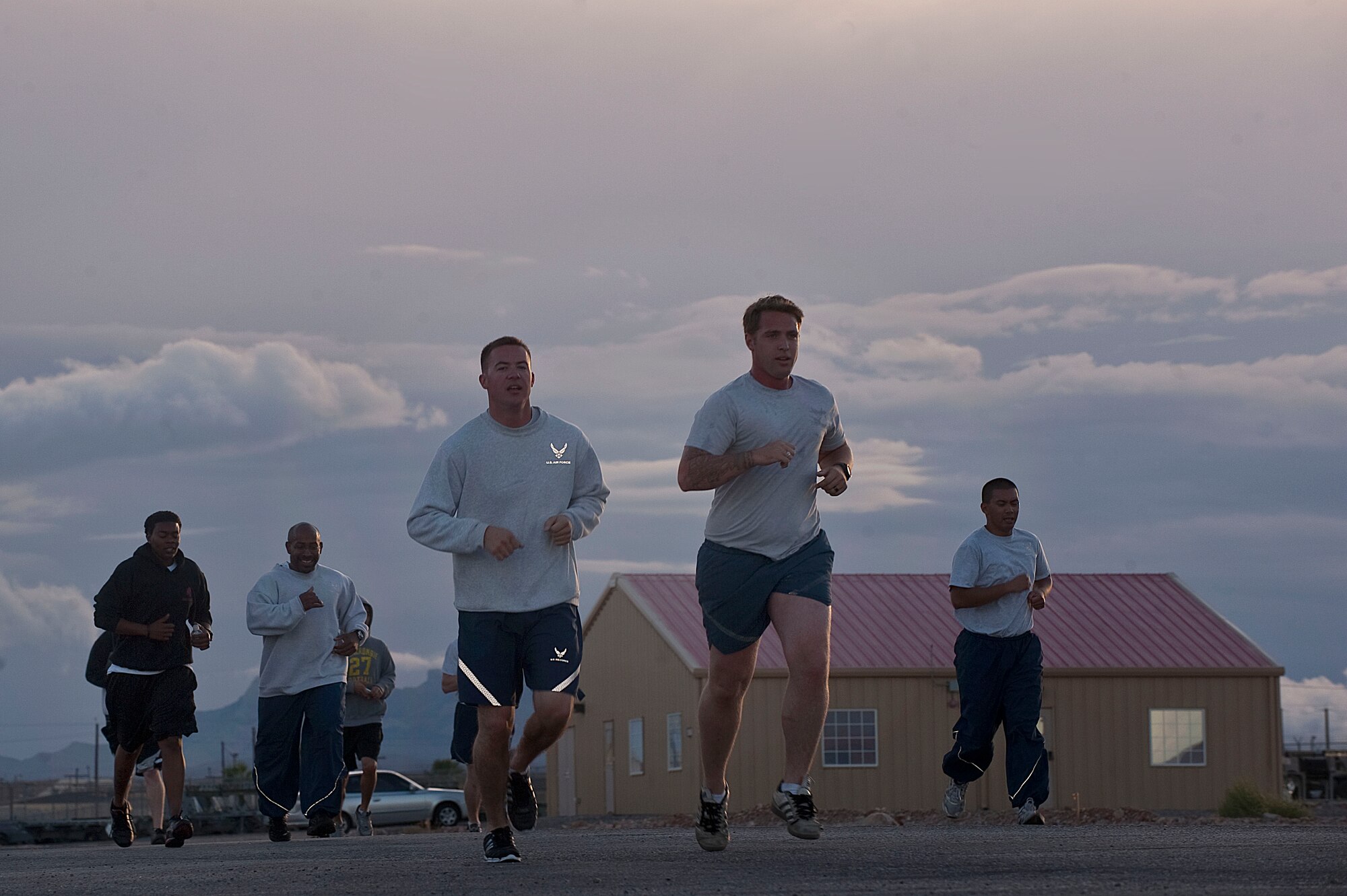 Airmen of the 820th RED HORSE, run towards the finish line during the RED HORSE 8.2 kilometer birthday run Oct. 12, 2012, at Nellis Air Force Base, Nev. Due to the need of a rapid response for base recovery, the first RED HORSE units were created with the activation of the 554th and 555th RED HORSE in 1965.  (U.S. Air Force photo by Staff Sgt. Christopher Hubenthal)