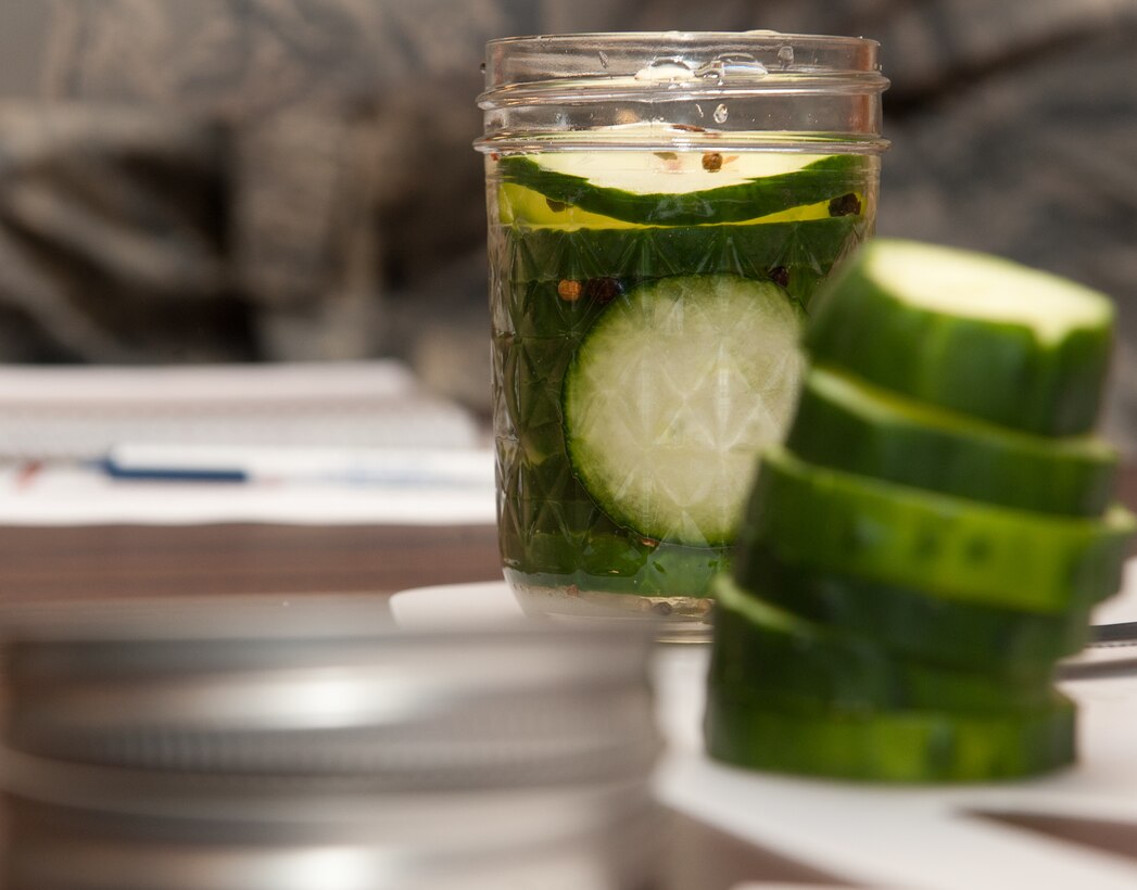 Sliced cucumbers await sealing during a canning workshop at the Airman and Family Readiness Center on Ellsworth Air Force Base, S.D., Oct. 11, 2012. When sealed properly, canning increases the shelf life of food by six months or more and can reduce the amount of food families throw away. (U.S. Air Force photo by Airmen 1st Class Kate Thornton-Maurer/Released)
