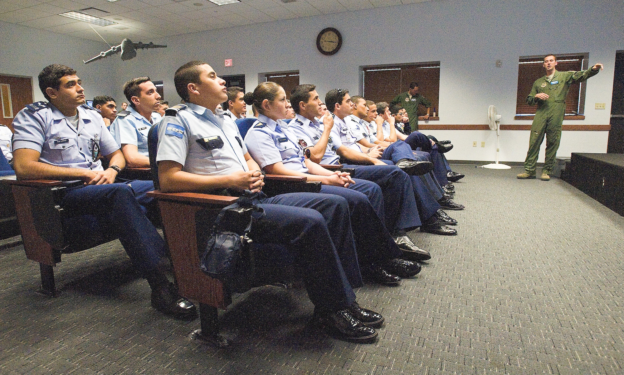 Cadets from 14 Latin American countries view a slideshow presentation on the capabilities of Team Dover's aircraft Oct. 11, 2012, at Dover Air Force Base, Del. The cadets visited the U.S. as part of the Latin American Cadets Initiative sponsored by the Secretary of the Air Force International Affairs Staff. 