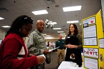 Lakeesha Washington (left), and Lt. Col. Dalian Washington, 20th Force Support Squadron commander, get information about HEART (Help Every Animal Reach Tomorrow) at Shaw’s Combined Federal Campaign fair, Shaw Air Force Base, S.C., Oct. 10, 2012. The CFC will be in effect and accepting donations until Nov. 16. (U.S. Air Force photo by Airman 1st Class Daniel Blackwell/Released)