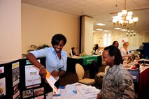 The representative for the South Carolina Child Care Services booth explains to Staff Sgt. Jaimie Gill, 20th Comptroller Squadron customer service NCOIC, about the different services and programs their organization offers at Shaw Air Force Base, S.C., Oct. 10, 2012. The Combined Federal Campaign will be in effect and accepting donations until Nov. 16. (U.S. Air Force photo by Airman 1st Class Daniel Blackwell/Released)