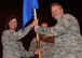 Lt. Col Kimbra Sterr, 131st Maintenance Group Commander, hands the guidon to Capt. Chad Larson as Larson assumes command of the 131st Maintenance Squadron, at a ceremony at Whiteman AFB, Sept. 7.  Sterr and Larson are members of the 131st Bomb Wing, Missouri Air National Guard.  (U.S. Air Force Photo by SrA Montse Belleau)