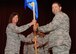 Lt. Col Kimbra Sterr, 131st Maintenance Group Commander, hands the guidon to Lt. Col. Mike Jurries as Jurries assumes command of the 131st Aircraft Maintenance Squadron, at a ceremony at Whiteman AFB, Sept. 7.  Sterr and Jurries are members of the 131st Bomb Wing, Missouri Air National Guard.  (U.S. Air Force Photo by SrA Montse Belleau)