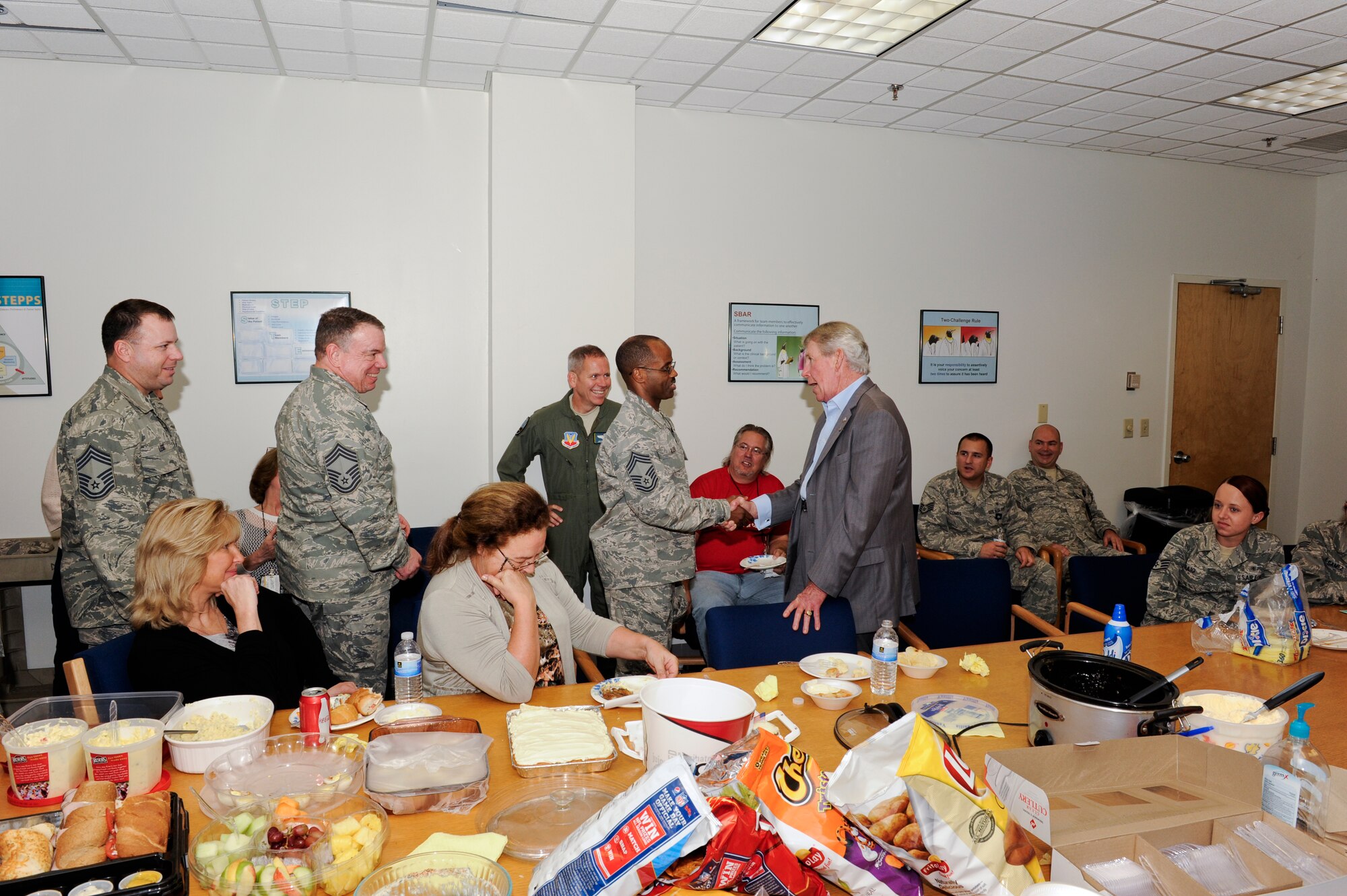 Tyndall chief master sergeants congratulate James Blanchard, 325th Medical Support Squadron health benefits advisor on his retirement. Blanchard served 30 years on active duty as an independent duty medical technician and retired as a chief master sergeant. Upon his retirement from active duty, he served nearly 20 years in civil service at Tyndall and retired Oct. 12. (U.S. Air Force photo by Chris Cokeing) 