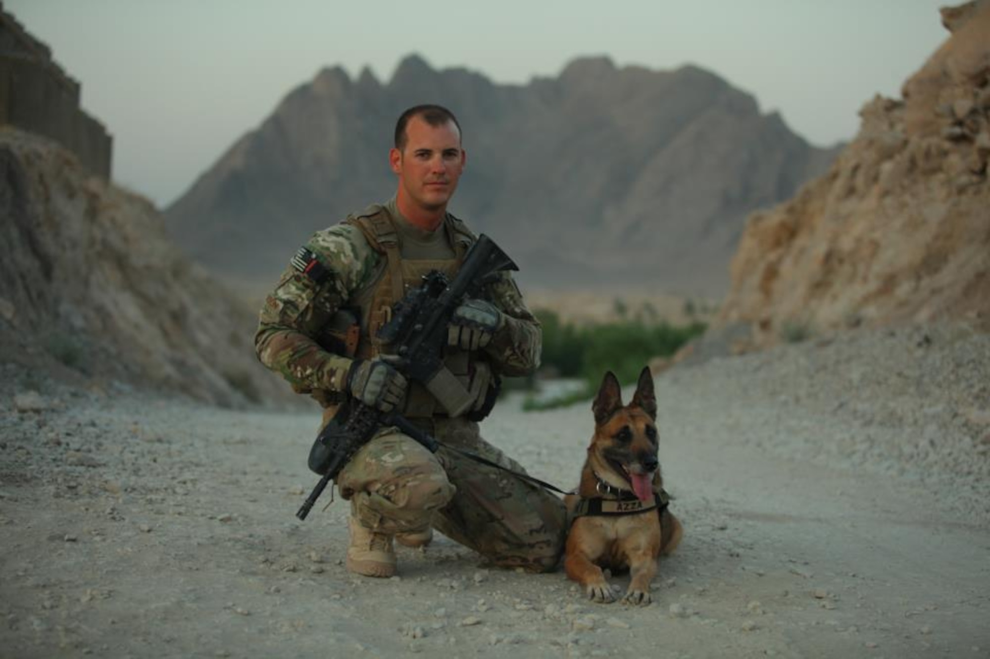 Staff Sgt. Leonard Anderson, 354th Security Force Squadron military working dog handler, poses for a photo with Azza, his military working dog, during a recent deployment to Afghanistan. (Courtesy photo)