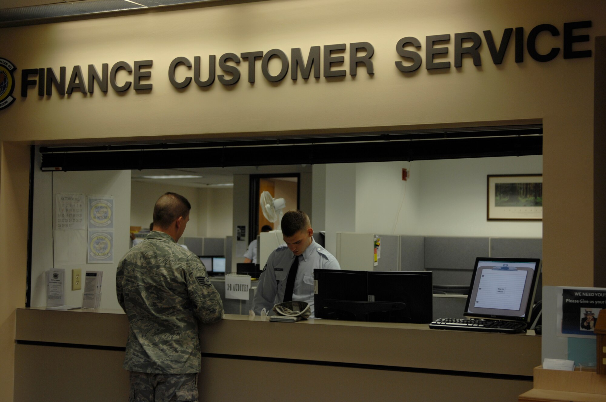 Staff Sgt. Gregory George, 20th Logistics Readiness Squadron allied trade technician, speaks to Senior Airman Ryan Brooks, 20th Comptroller Squadron costumer service technician, at Shaw Air Force Base, S.C., Oct. 15, 2012. Finance personnel are available for questions about Thrift Saving Plan and the new Roth program. For additional information about TSP and Roth, go to http://www.TSP.gov. (U.S. Air Force photo by Airman 1st Class Krystal M . Jeffers/Released)

