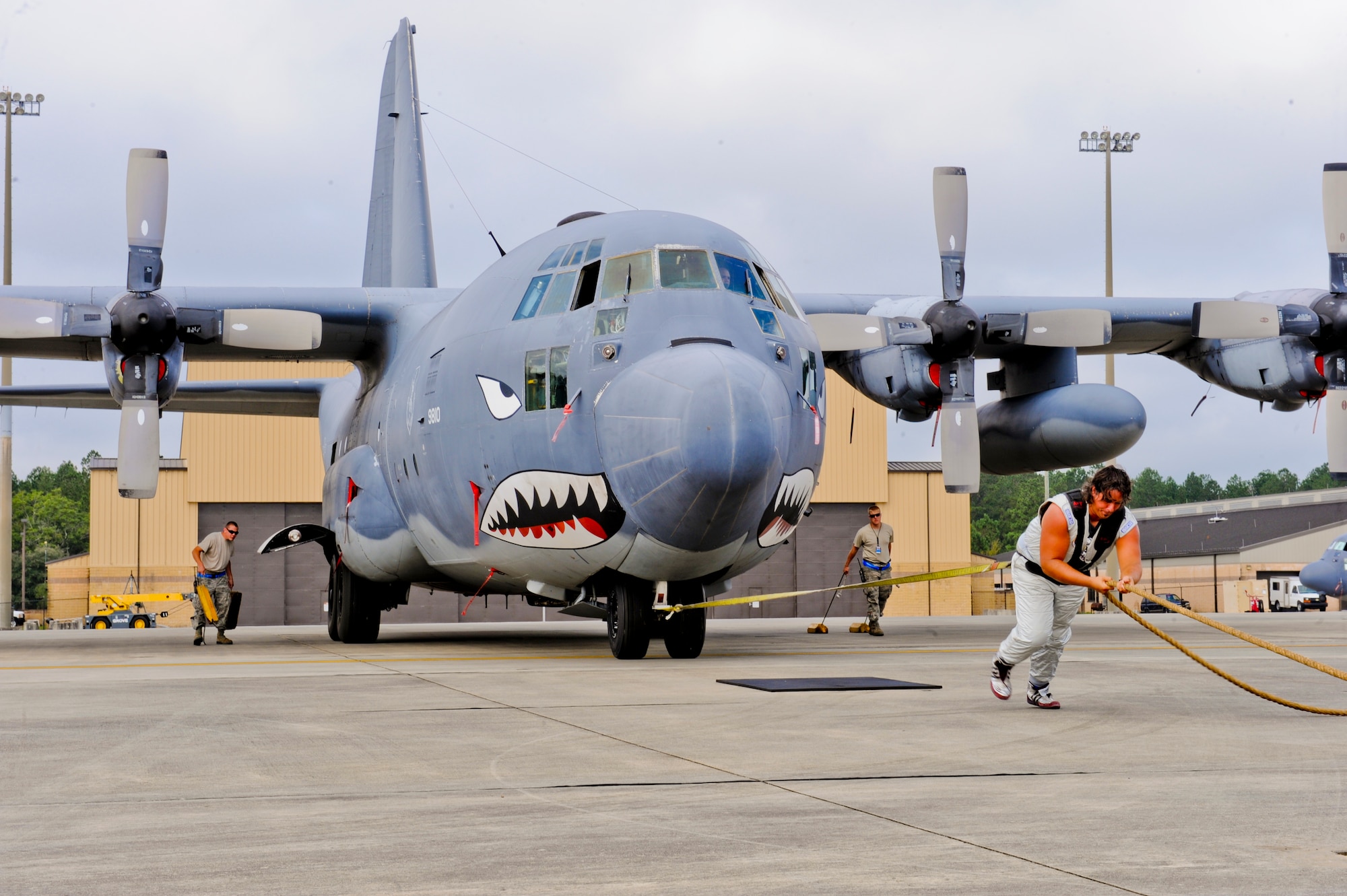 Mark Kirsch, strong man for "Man vs. Jumbo Jets", pulls an HC-130 Combat King at Moody Air Force Base, Ga., Oct. 5, 2012. Kirsch will be performing in the upcoming open house, Oct. 27-28, where he will be pulling a HC-130 Combat King. (U.S. Air Force photo by Staff Sgt. Joshua J. Garcia/Released)