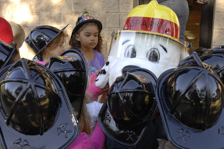 Children at the Child Development Center greet Sparky the Fire Dog at Shaw Air Force Base, S.C., Oct. 12, 2012. Sparky was visiting all the classes at the CDC during Fire Prevention Week to get the children familiar with him, firemen and fire safety. (U.S. Air Force photos by Airman 1st Class Krystal M. Jeffers/Released)