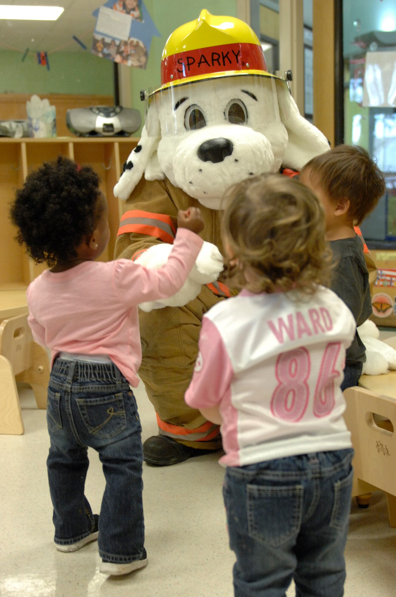 Sparky the Fire Dog visits the Child Development Center during Fire Prevention Week at Shaw Air Force Base, S.C., Oct. 12, 2012. The first Fire Prevention Day was proclaimed in 1920 by President Wilson in remembrance of the tragic Chiago fire in 1871. (U.S. Air Force photos by Airman 1st Class Krystal M. Jeffers/Released)