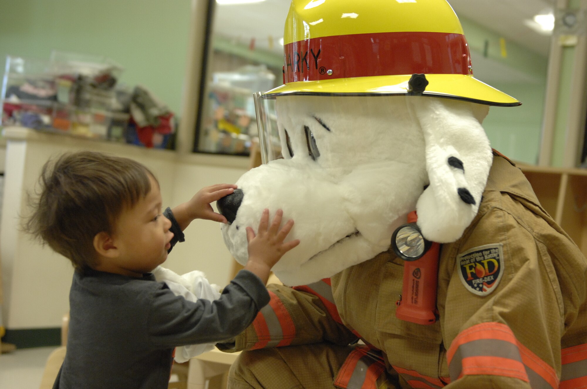 Sparky the Fire Dog visits the Child Development Center during Fire Prevention Week at Shaw Air Force Base, S.C., Oct. 12, 2012. Fire Prevention Week held on the week of Oct. 9 every year in remembrance of the tragic Chicago Fire in 1871. (U.S. Air Force photos by Airman 1st Class Krystal M. Jeffers/Released)
