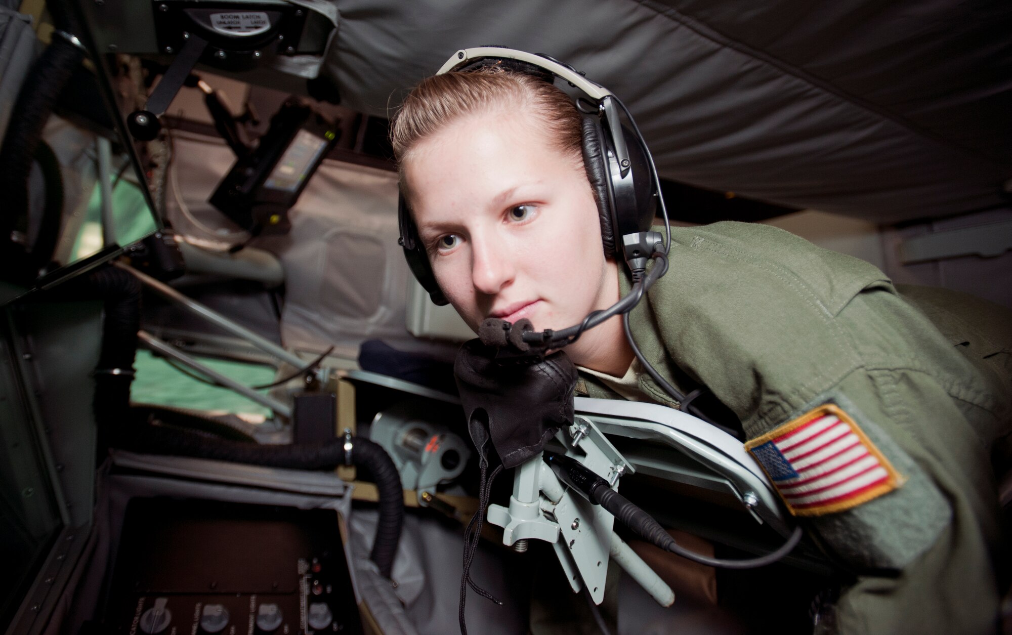Airman 1st Class Alexis Mitchell, 349th Air Refueling Squadron boom operator, looks over the control panel of the Boom Operator Weapons Training Simulator during a training session Oct. 11, 2012, McConnell Air Force Base, Kan. The BOWST is an inexpensive way to train boom operators in a realistic manner on the ground. Mitchell was chosen to be the 349th ARS spotlight performer for the week of Oct. 8 to 12, 2012. (U.S. Air Force photo/Airman 1st Class Victor J. Caputo)