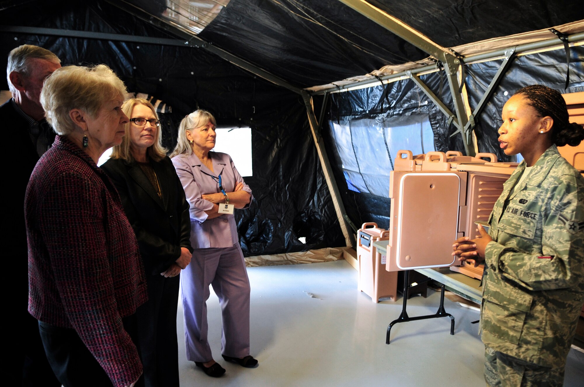 U.S. Air Force Airman 1st Class Diyonda Vickers, 20th Force Support Squadron food technician, briefs U.S. Air Force retired general officers about the updated field kitchens during their visit at Shaw Air Force Base, S.C., Oct. 11, 2012.  The retired generals gathered for the Tri-State Leadership Forum at the Carolina Skies Club and Conference Center for a series of presentations.  They also visited Hangar 1200 to view demonstrations and interact with 20th Fighter Wing personnel, and participated in a driving tour of the base. (U.S. Air Force photo by Airman Nicole Sikorski/Released)
