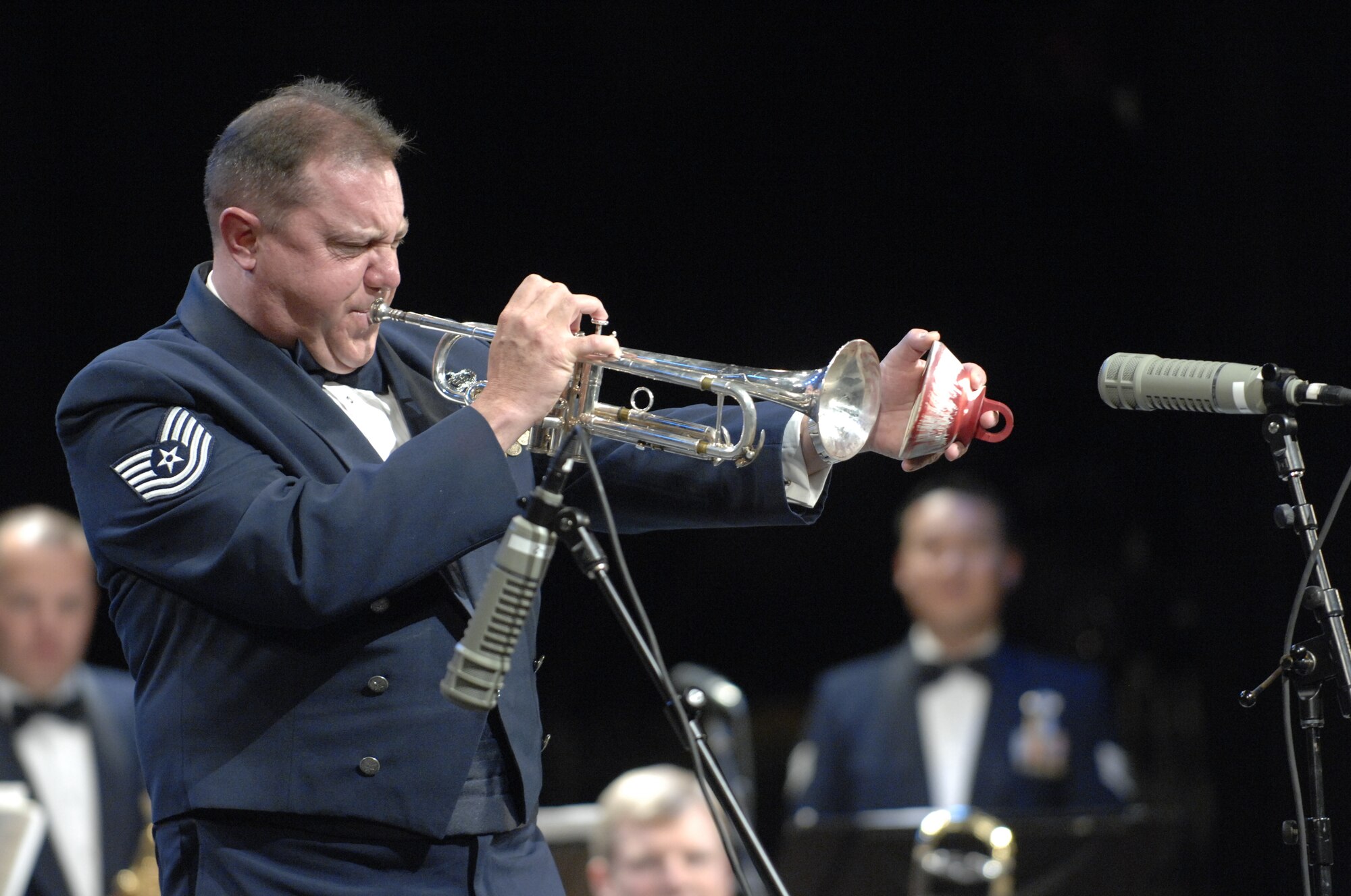 Tech. Sgt. Marcel Marchetti, a member of the U.S. Air Force Falconaires Big Band and a native of Antioch, Calif., plays a solo on the trumpet during a show at the Patriot Hall at Sumter, S.C., Oct. 12, 2012. Marchetti is one of the four people who play a trumpet for the Falconaires. (U.S. Air Force photo by Airman 1st Class Krystal M. Jeffers/Released)
