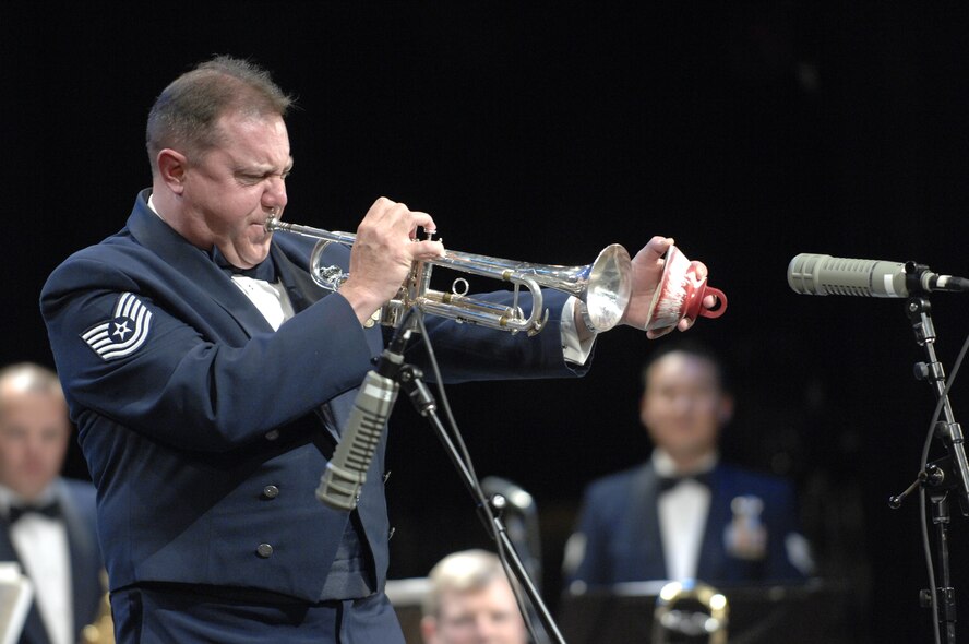 Tech. Sgt. Marcel Marchetti, a member of the U.S. Air Force Falconaires Big Band and a native of Antioch, Calif., plays a solo on the trumpet during a show at the Patriot Hall at Sumter, S.C., Oct. 12, 2012. Marchetti is one of the four people who play a trumpet for the Falconaires. (U.S. Air Force photo by Airman 1st Class Krystal M. Jeffers/Released)