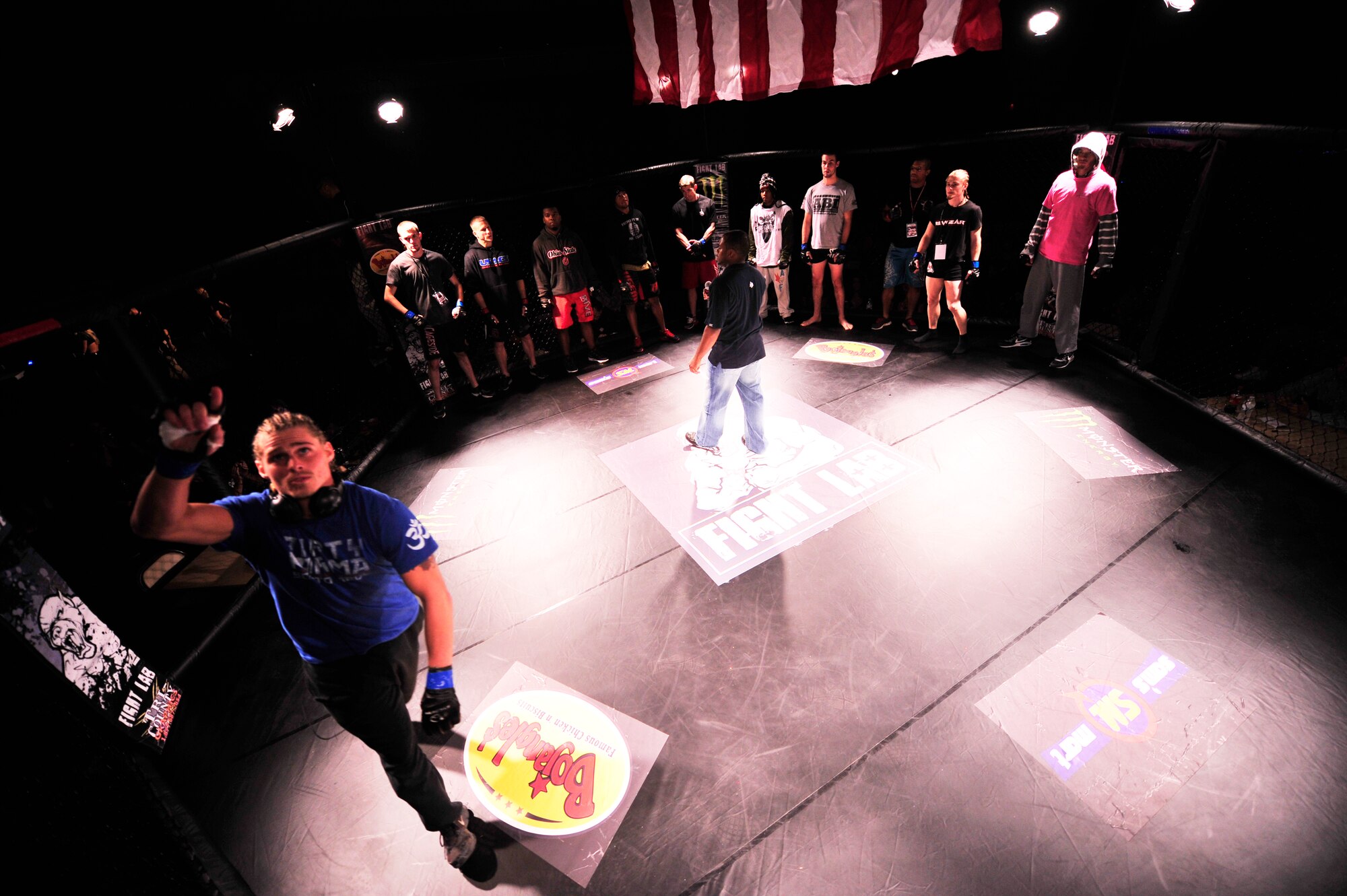 Mixed martial arts fighters enter the cage before the mma fight at the fitness center, Shaw Air Force Base, S.C., Oct. 12, 2012.  Earlier in the day the fighters weighed in at the Carolina Skies Club and Conference Center and evaluated their competition. After the fight, Team Shaw members were invited to Carolina Skies for an after party.  (U.S. Air Force photo by Airman Nicole Sikorski/Released)