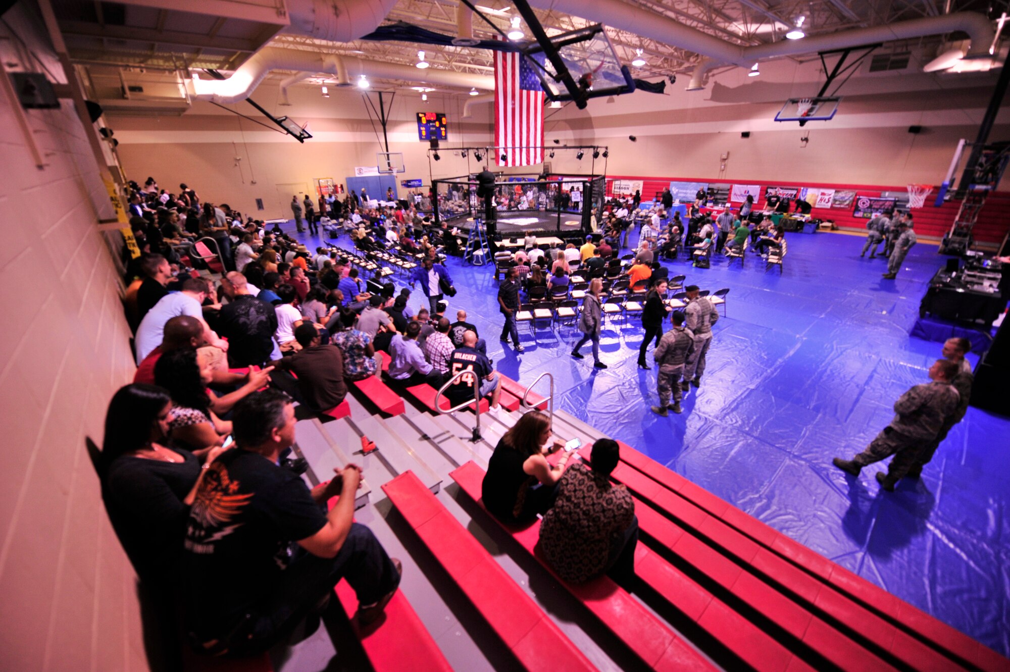 Team Shaw members gather at the fitness center for the mixed marital arts cage fight, Shaw Air Force Base, S.C., Oct. 12, 2012.  18 fighters came to Shaw for the event and were paired together for 9 fights.(U.S. Air Force photo by Airman Nicole Sikorski/Released)