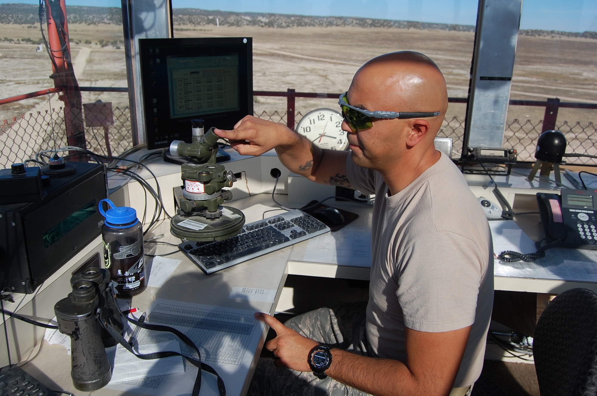 Senior Master Sgt. Manuel Gomez, range NCOIC, 140th Operations Support Squadron, operates a bomb scoring device to evaluate how accurately the pilots hit their specified targets. (U.S. Air Force Photo / Capt. Kinder Blacke)