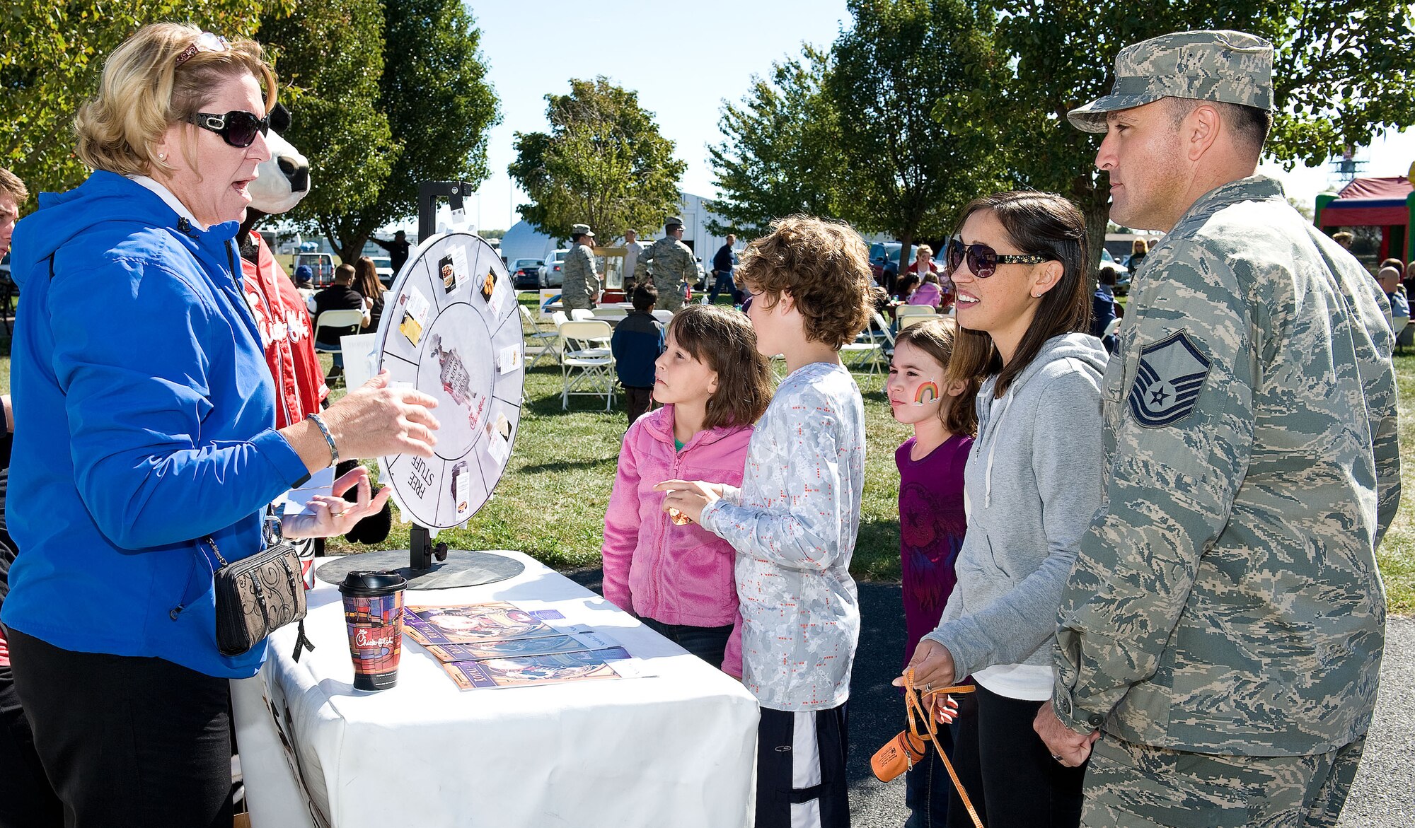 Mary Johnson, left, franchise restaurant operator of Chick-fil-A of North Dover, speaks with Master Sgt. Todd Ritchey of the 512th Logistics Readiness Squadron during the Military Appreciation Day Picnic Oct. 13, 2012, at the Air Mobility Command Museum on Dover Air Force Base, Del. The picnic brought together Team Dover and community members to enjoy barbeque, bouncy castles and live music. (U.S. Air Force photo by Roland Balik)
