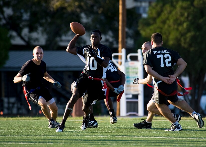 Earnest Sims, 7th Logistics Readiness Squadron quarterback, throws the ball Oct. 11, 2012, during a flag football game at Dyess Air Force Base, Texas. The Dyess intramural flag football league kicked off Oct. 9 and continues until November. Following the regular season, the top teams from each division will participate in a double elimination tournament to determine the 2012 Dyess flag football champions. (U.S. Air Force photo by Airman 1st Class Damon Kasberg/ Released)