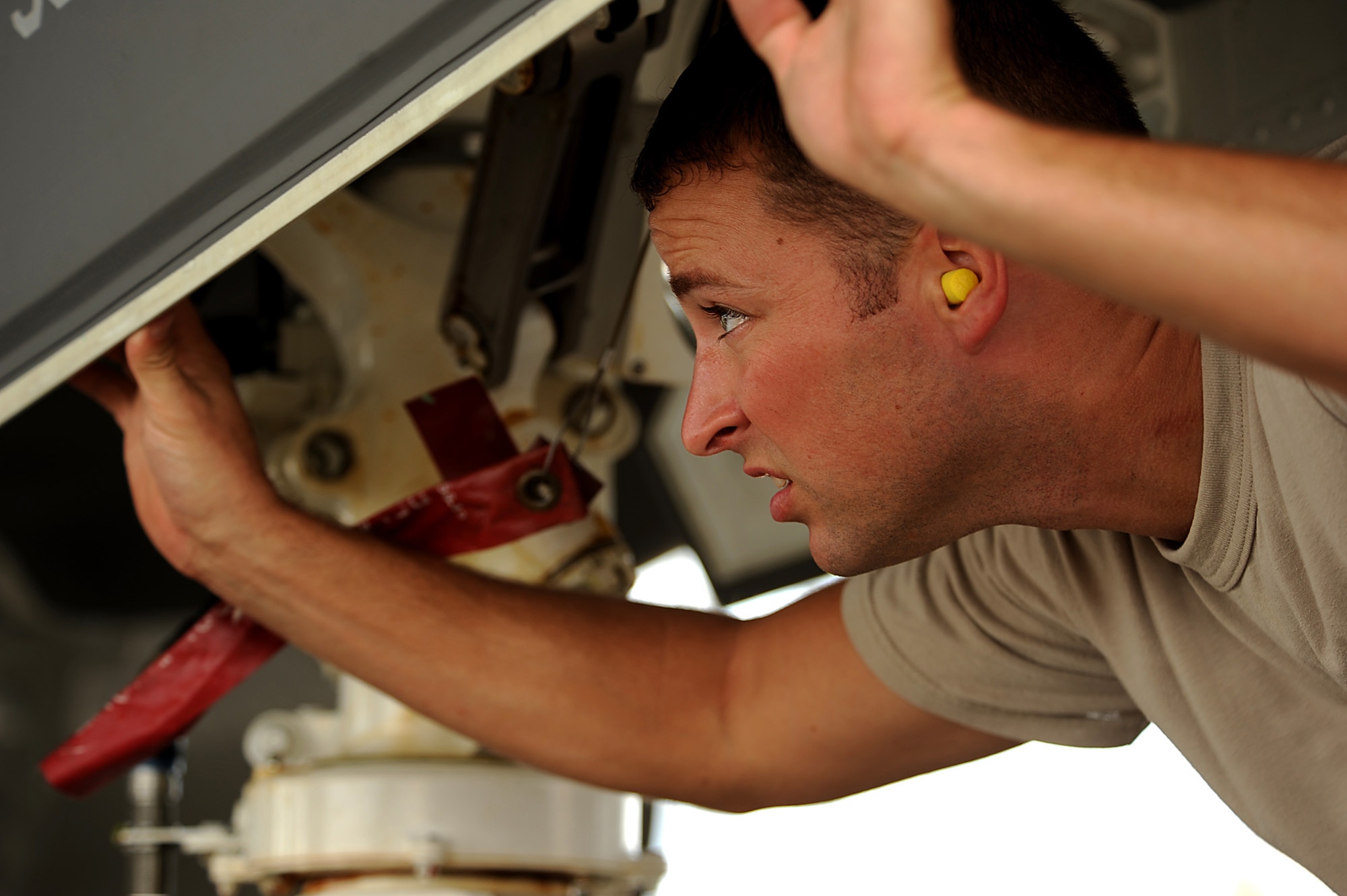 F-35A Lightning II joint strike fighter Crew Chief Staff Sgt. Jeremy Deck from the 58th Aircraft Maintenance Unit at Eglin Air Force Base, Fla., checks over the jet after a local training mission over the Emerald Coast Sept. 18, 2012.  (U.S. Air Force photo/Master Sgt. Jeremy T. Lock)