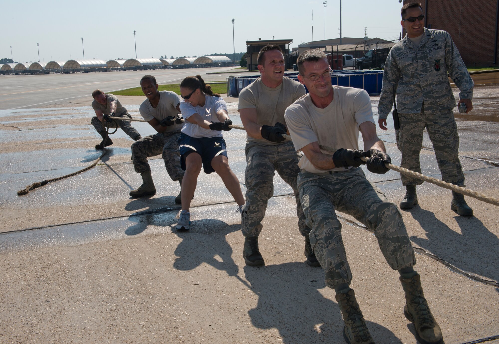 Moody Airmen pull a P-19 fire truck during a Fire Muster Challenge at Moody Air Force Base, Ga., Oct. 11, 2011. The challenge consisted of four events: bucket brigade, hose connection/water stream, hose roll and P-19 pull. (U.S. Air Force photo by Senior Airman Douglas Ellis/Released)
