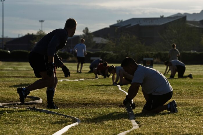 Nellis Airmen participate in the fifth annual Fire Muster competition at the Sports Pavilion Oct. 12, 2012, at Nellis Air Force Base, Nev. The Fire Muster challenges Airmen through simulated tasks a fireman or emergency responder could encounter during a real world incident. (U.S. Air Force photo by Senior Airman Daniel Hughes)