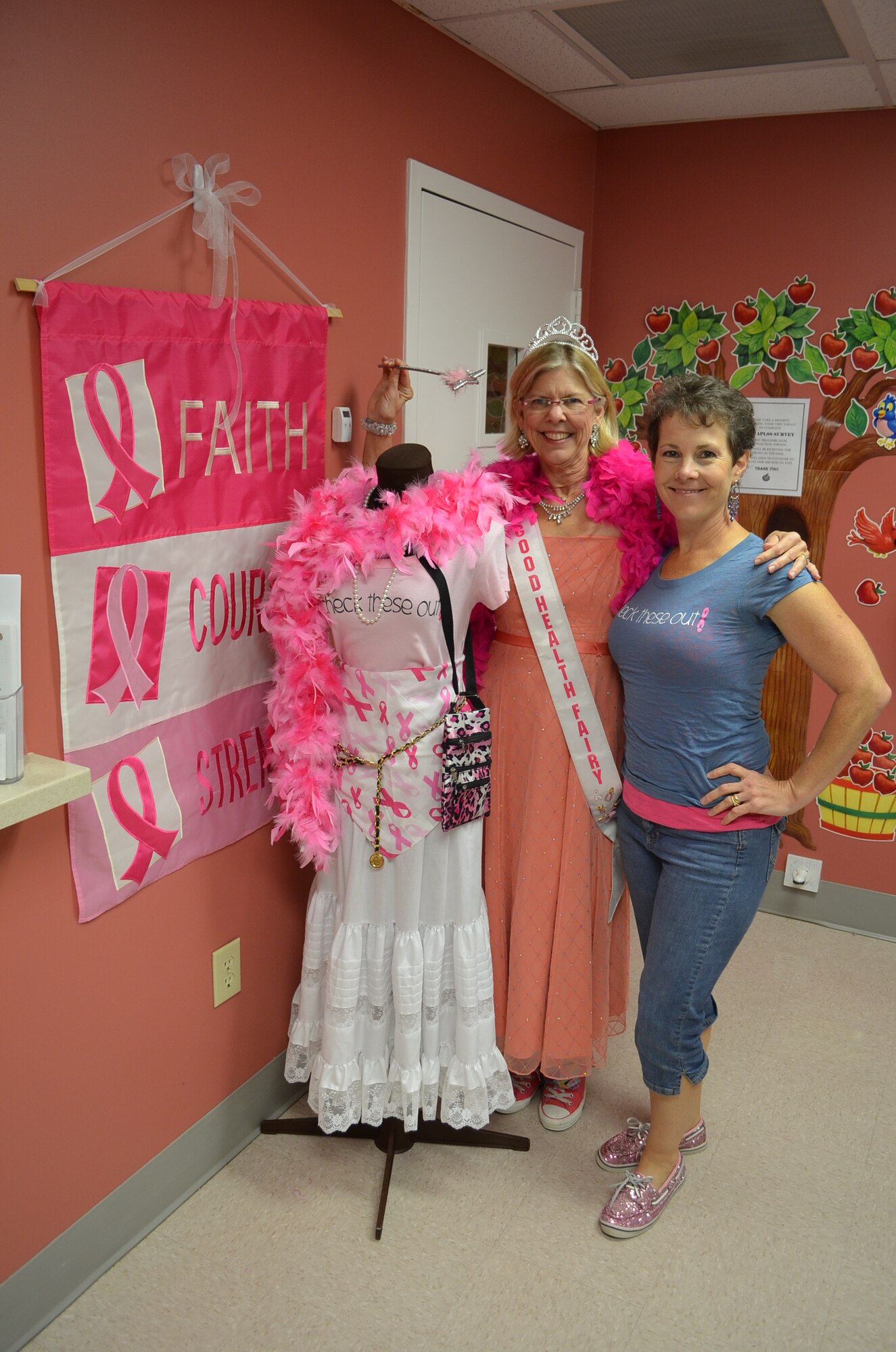 Mary Beth Gibson (standing) and Rene Bowditch co-founded “Beyond Boobs!” six years ago as a small group of women with breast cancer who came together to share love with one another throughout their treatment and healing process.  Now, the group is a non-profit health organization at the MacDonald Army Health Center at Fort Eustis, Va., focusing on moving women beyond passive awareness of breast cancer to the point of taking the necessary steps to reduce risk and ensure early detection.  (Courtesy photo by Marlon J. Martin / Released)  