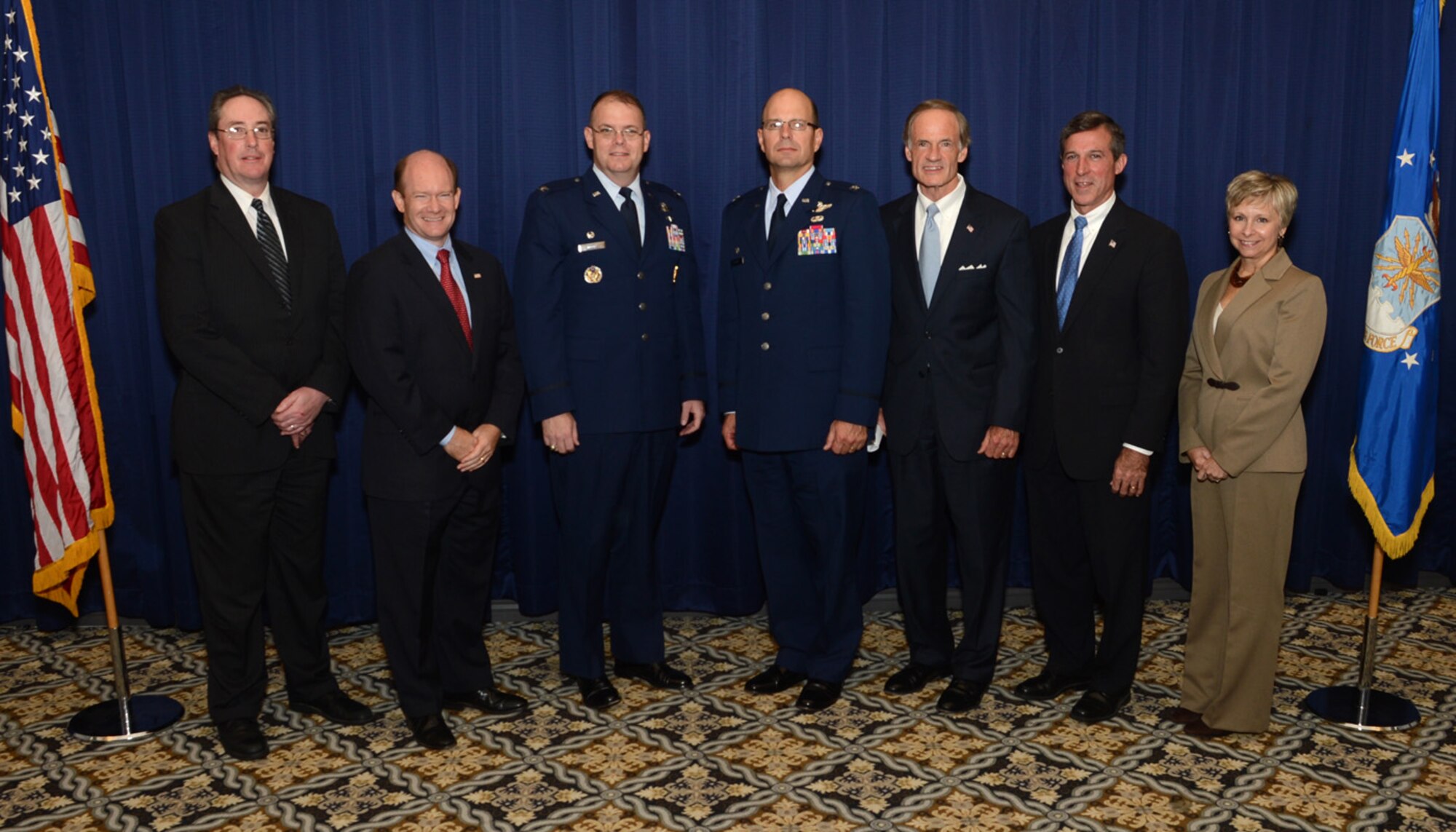 From left-to-right), Vic Schimp, chairman of the Central Delaware Chamber of Commerce; U.S. Sen. Chris Coons of Delaware; Col. Rick Moore, 436th Airlift Wing commander; Col. Raymond A. Kozak, 512th Airlift Wing commander; U.S. Sen. Tom Carper of Delaware; U.S. Rep. John Carney of Delaware; and Judy Diogo, president of the CDCC; pose for a photograph at the 2012 Military Construction Breakfast Oct. 15, 2012, at The Landings Club on Dover Air Force Base, Del. The MILCON Breakfast is a CDCC event held to inform the public about current and future construction projects on Dover AFB. (U.S. Air Force photo by Tech. Sgt. Chuck Walker)