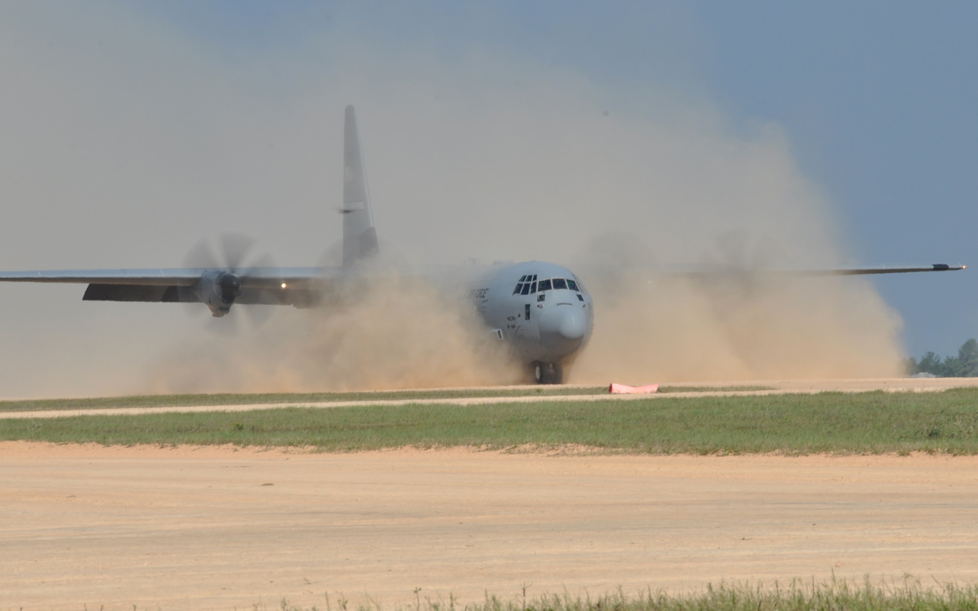 A C-130 from Little Rock Air Force Base, Ark., rolls through the dust it conjured on the landing zone during a Joint Readiness Training Center exercise Oct. 11, 2012, at Ft. Polk, La. The C-130s were used to transport simulated injured and casualties from the exercise site to the simulated medical facility in nearby Alexandria, La. (U.S. Air Force photo by Staff Sgt. Jacob Barreiro)