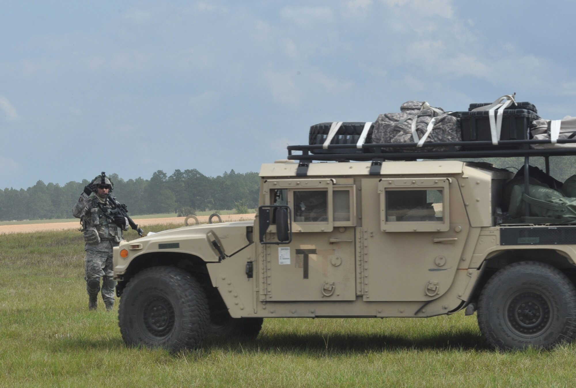 A soldier directs a Humvee during a Joint Readiness Training Center exercise Oct. 10, 2012, at Ft. Polk, La. The exercise is one of the largest the JRTC has conducted in years, and is designed to test a joint force’s ability to conduct missions in an expeditionary environment. (U.S. Air Force photo by Staff Sgt. Jacob Barreiro)