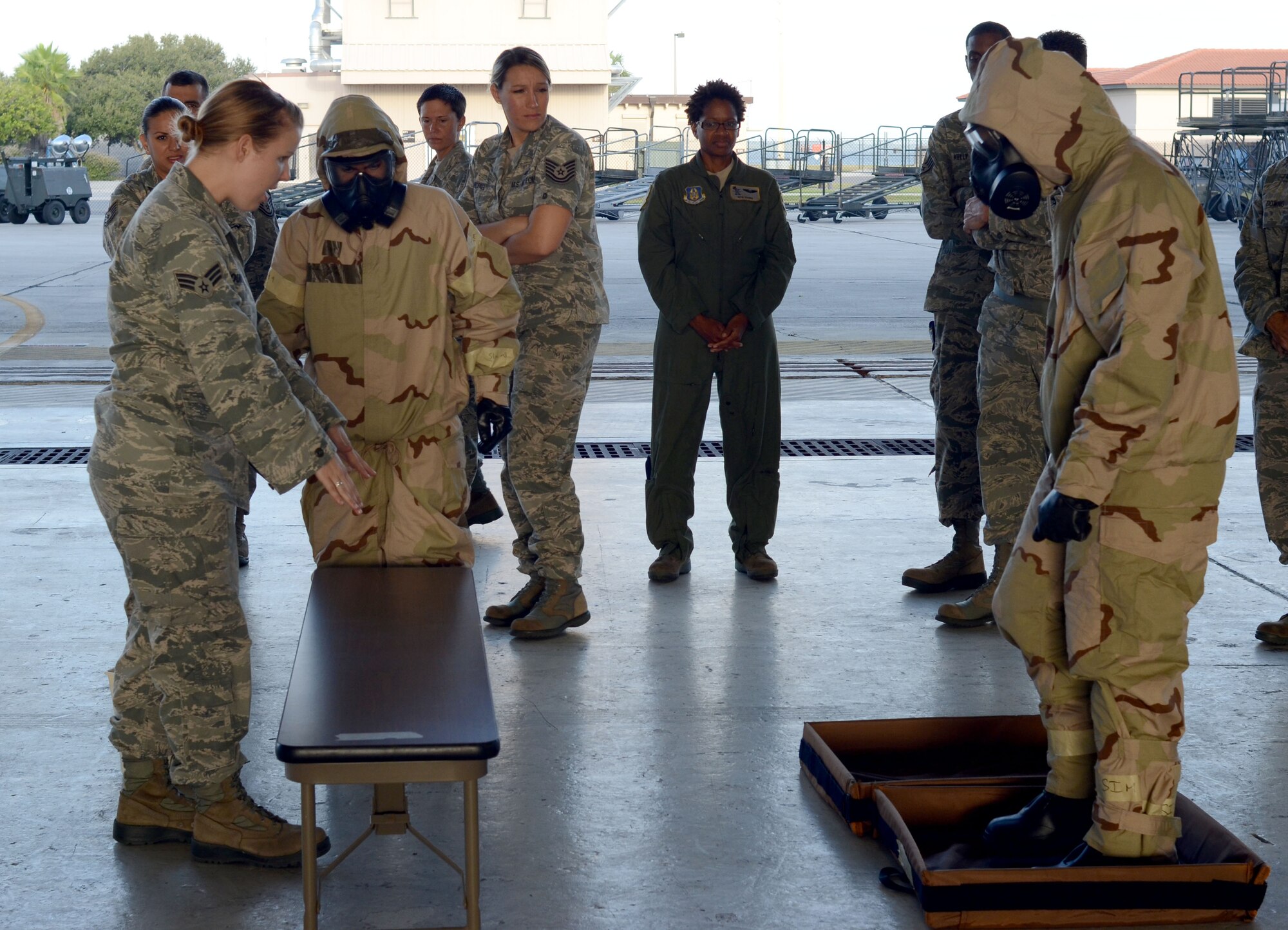 Senior Airman Brenna Young, Emergency Management Journeyman, explains steps in the chemical decontamination process here during the 920th Rescue Wing's Unit Training Assembly Sunday. Reserve Airmen continue their training for a Combined Unit Inspection that test the skills and preparedness of the Reservists during scenarios that mimic what they may find while deployed in a combat environment. They will have their deployment readiness tested with an official grade by an inspection team during the final phase of the Inspection slated for April 2013. (U.S. Air Force photo/2nd Lt. Leslie Forshaw) 