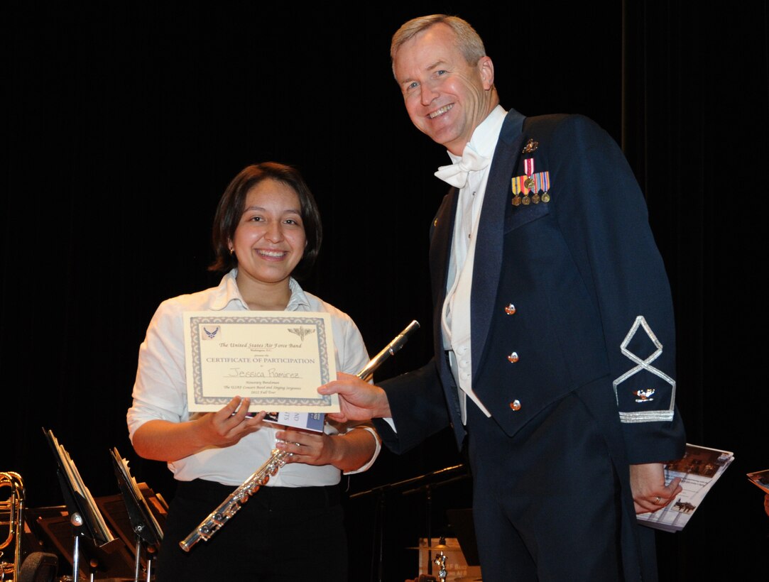 Col. Larry Lang, U.S. Air Force Band commander and conductor, presents a certificate to an Honorary Bandsmen during the U.S. Air Force Band and Singing Sergeants 2012 Fall Tour at the National Steinbeck Center's Sherwood Hall in Salinas, Calif., Oct 14. The concert was the third of 14 performances that will take place in California and Arizona. (U.S. Air Force photo/ Staff Sgt. Keyonna Fennell)