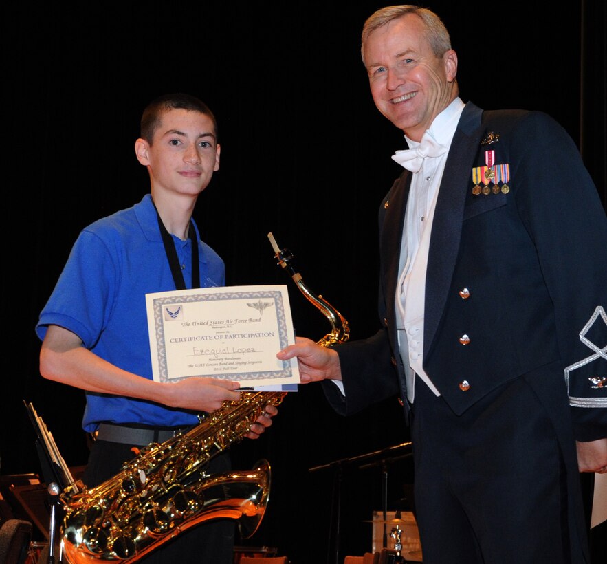Col. Larry Lang, U.S. Air Force Band commander and conductor, presents a certificate to an Honorary Bandsmen during the U.S. Air Force Band and Singing Sergeants 2012 Fall Tour at the National Steinbeck Center's Sherwood Hall in Salinas, Calif., Oct 14. The concert was the third of 14 performances that will take place in California and Arizona. (U.S. Air Force photo/ Staff Sgt. Keyonna Fennell)