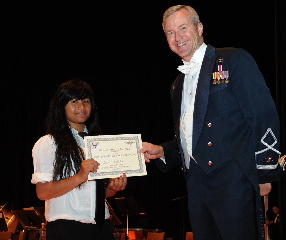 Col. Larry Lang, U.S. Air Force Band commander and conductor, presents a certificate to an Honorary Bandsmen during the U.S. Air Force Band and Singing Sergeants 2012 Fall Tour at the National Steinbeck Center's Sherwood Hall in Salinas, Calif., Oct 14. The concert was the third of 14 performances that will take place in California and Arizona. (U.S. Air Force photo/ Staff Sgt. Keyonna Fennell)