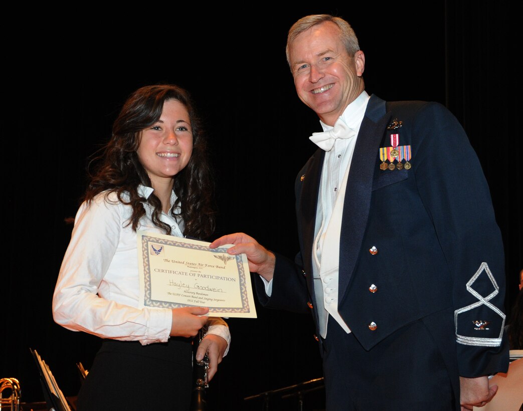 Col. Larry Lang, U.S. Air Force Band commander and conductor, presents a certificate to an Honorary Bandsmen during the U.S. Air Force Band and Singing Sergeants 2012 Fall Tour at the National Steinbeck Center's Sherwood Hall in Salinas, Calif., Oct 14. The concert was the third of 14 performances that will take place in California and Arizona. (U.S. Air Force photo/ Staff Sgt. Keyonna Fennell)