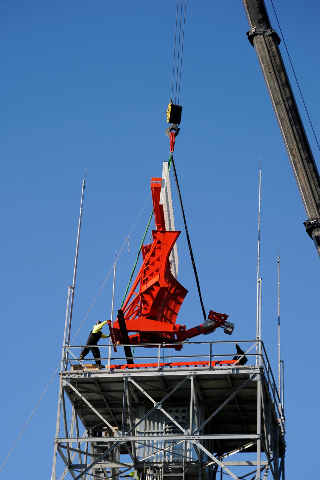 The radar unit of a new DAS-R -- digital airport surveillance radar – is lifted onto a newly-constructed tower at Selfridge Air National Guard Base, Mich., Oct. 12, 2012. The new $17 million system will become operation in 2013, replacing an older system in use on the base. The new tower 94-foot tower is more than two dozen feet taller than the older, existing radar tower on the base. (Air National Guard photo by John S. Swanson)