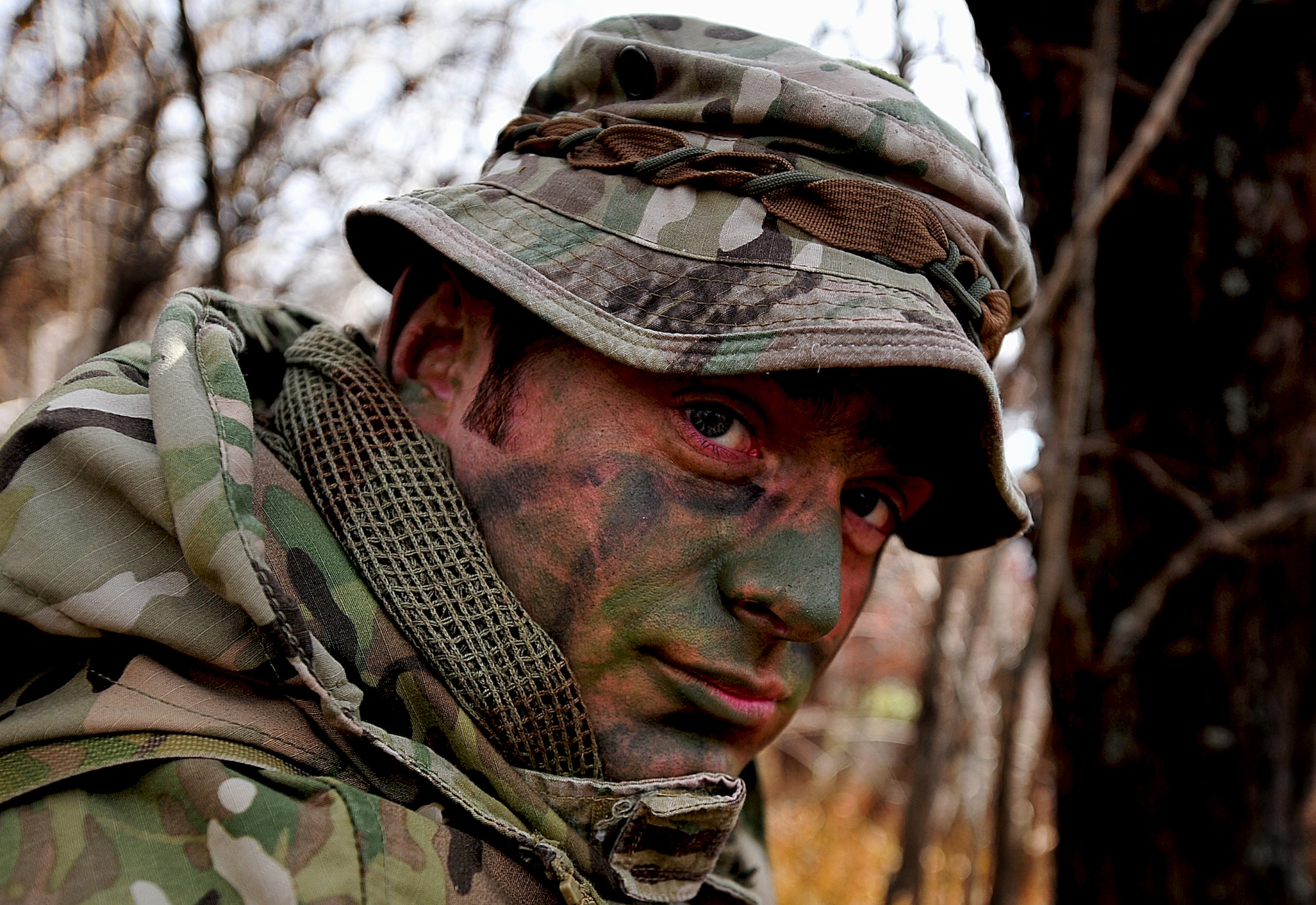 U.S. Air Force Tech. Sgt. Bobby Colliton, Survival Evasion Resistance and Escape (SERE) specialist from the 18th Operation Support Squadron on Kadena Air Base, Japan, performs Combat Survival Training with a 33rd Rescue Squadron aircrew member during Exercise Pacific Thunder near Osan Air Base, Republic of Korea, Oct. 15, 2012. Pacific Thunder is an annual two-week exercise that involves the 31st and 33rd RQS from Kadena AB, Japan, and the 25th Fighter Squadron from Osan. These units work together to practice combat search and rescue tactics to prepare for real-world emergency situations.(U.S. Air Force photo/Staff Sgt. Sara Csurilla)