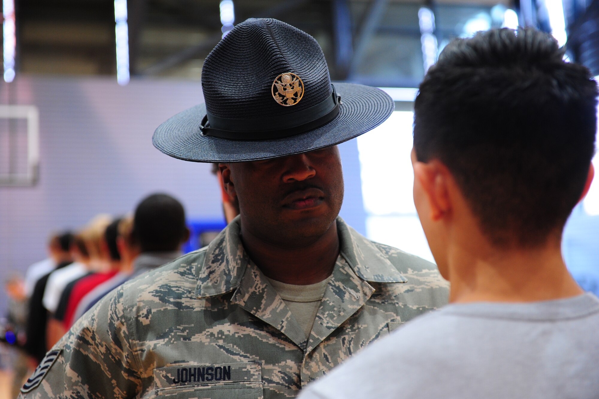 Tech Sgt. Brandon Johnson, 86th Airlift Wing Knowledge Operations section chief, waits for a reporting statement from a member of the Delayed Entry Program on Ramstein Air Base, Germany, Oct. 11, 2012. Former Military Training Instructors were invited to give DEP members a feel of what to expect at Basic Military Training. (U.S. Air Force photo/ Airman 1st Class Kendra Alba)