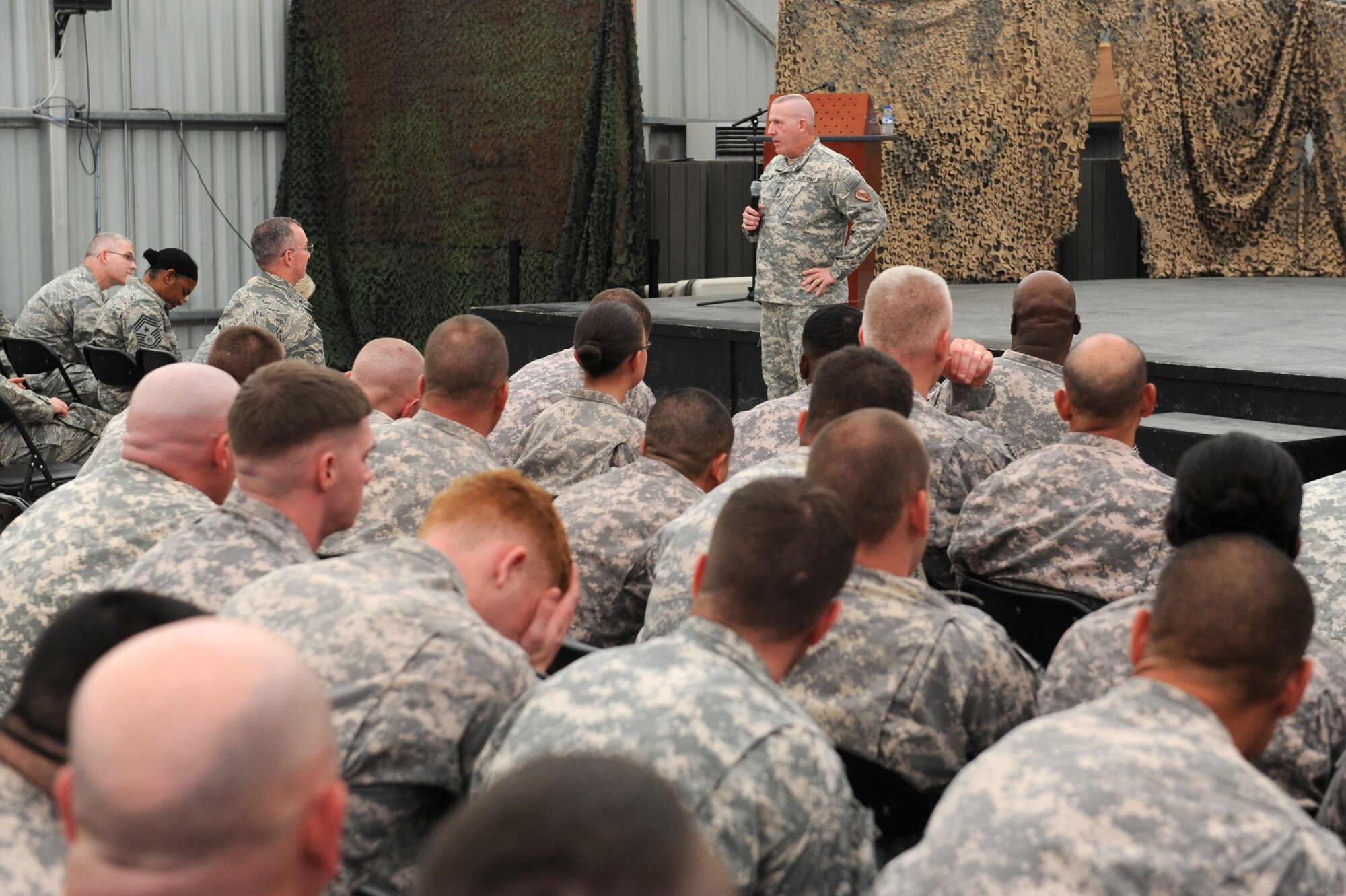 SOUTHWEST ASIA - U.S. Army Command Sgt. Maj. Frank Grippe, U.S. Central Command senior enlisted leader, speaks to Airmen and Soldiers of the 380th Air Expeditionary Wing Oct. 11, 2012. Grippe gave an overview of what military forces here bring to the CENTCOM mission and answered questions from the audience during his briefing. (U.S. Air Force photo/Master Sgt. Scott MacKay)