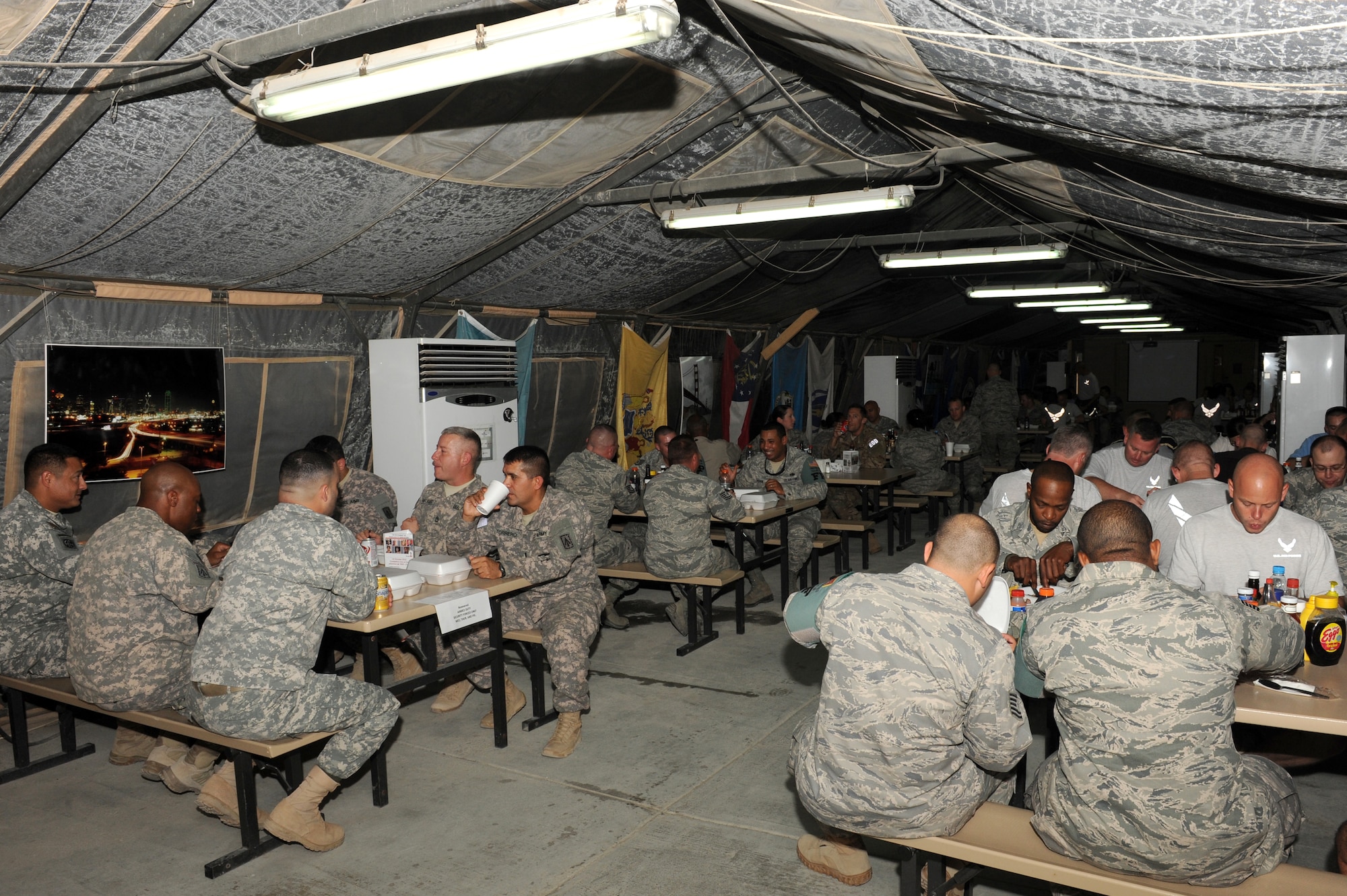 SOUTHWEST ASIA - U.S. service members dine in the Windy's dining facility at the 380th Air Expeditionary Wing Oct. 10, 2012. Windy's is a "well-known tent" in the region, according to Sgt. 1st Class Samueal Hill, Windy’s dining facility manager. (U.S. Air Force photo/Master Sgt. Scott MacKay)